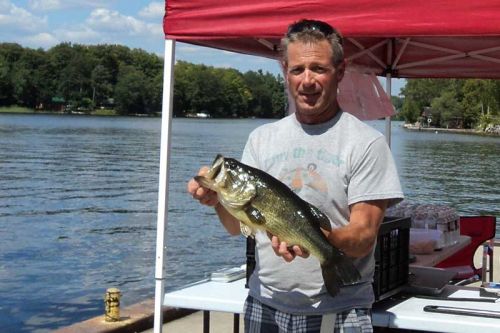 Photo: Wayne Sharrock with his $500 first place 4.96 pound large mouth bass that he caught on Sharbot Lake 